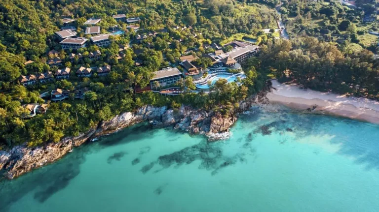 Aerial View of Coastal Resort with Multi-Tiered Pool and Beach at Nai Thon Beach