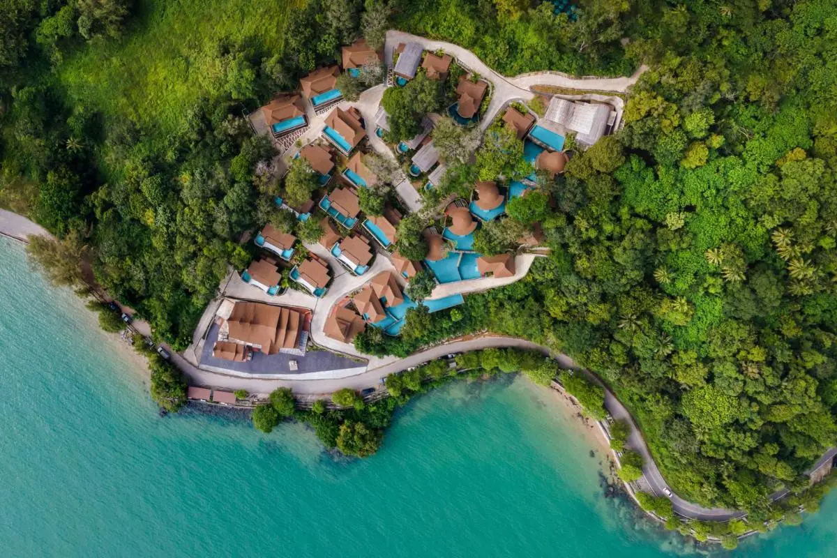 Aerial View of Coastal Resort with Private Pools on Forested Hillside in Phuket Town