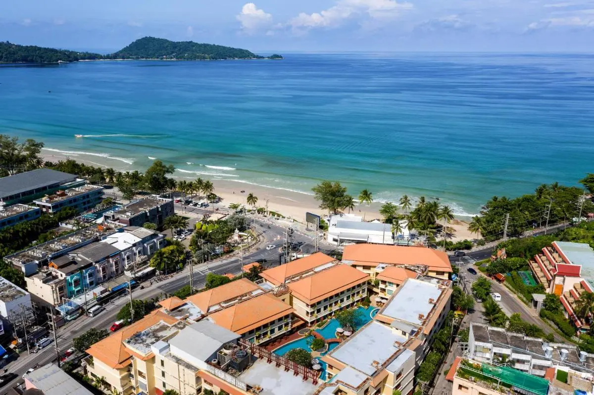 Patong Paragon Resort & Spa SHA Extra Plus Aerial View of Coastal Urban Complex with Pool Near Patong Beach Shoreline