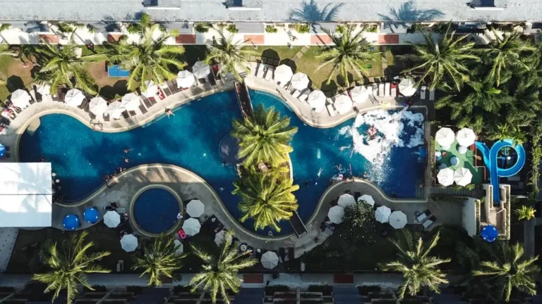 Aerial View of Large Outdoor Swimming Pool Complex with Jacuzzi and Water Slide at Kamala Beach