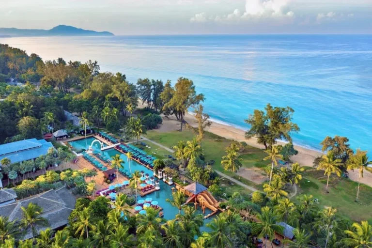 Aerial View of Large Pool Complex and Sandy Beach at Mai Khao Coastal Area