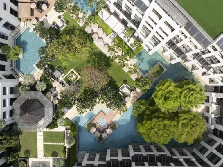 Aerial View of Modern Courtyard with Multiple Pools and Green Spaces in Pathumwan Bangkok