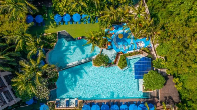 Aerial View of Multi-Section Outdoor Swimming Pool Complex with Play Area and Lounge Seating at Kata Beach