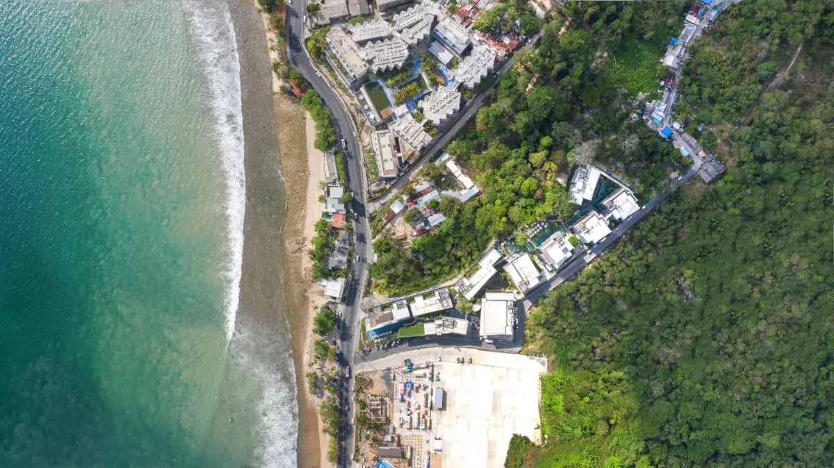 The Nature Phuket Aerial View of Patong Beach Coastal Area Featuring Pools and Ocean Shoreline