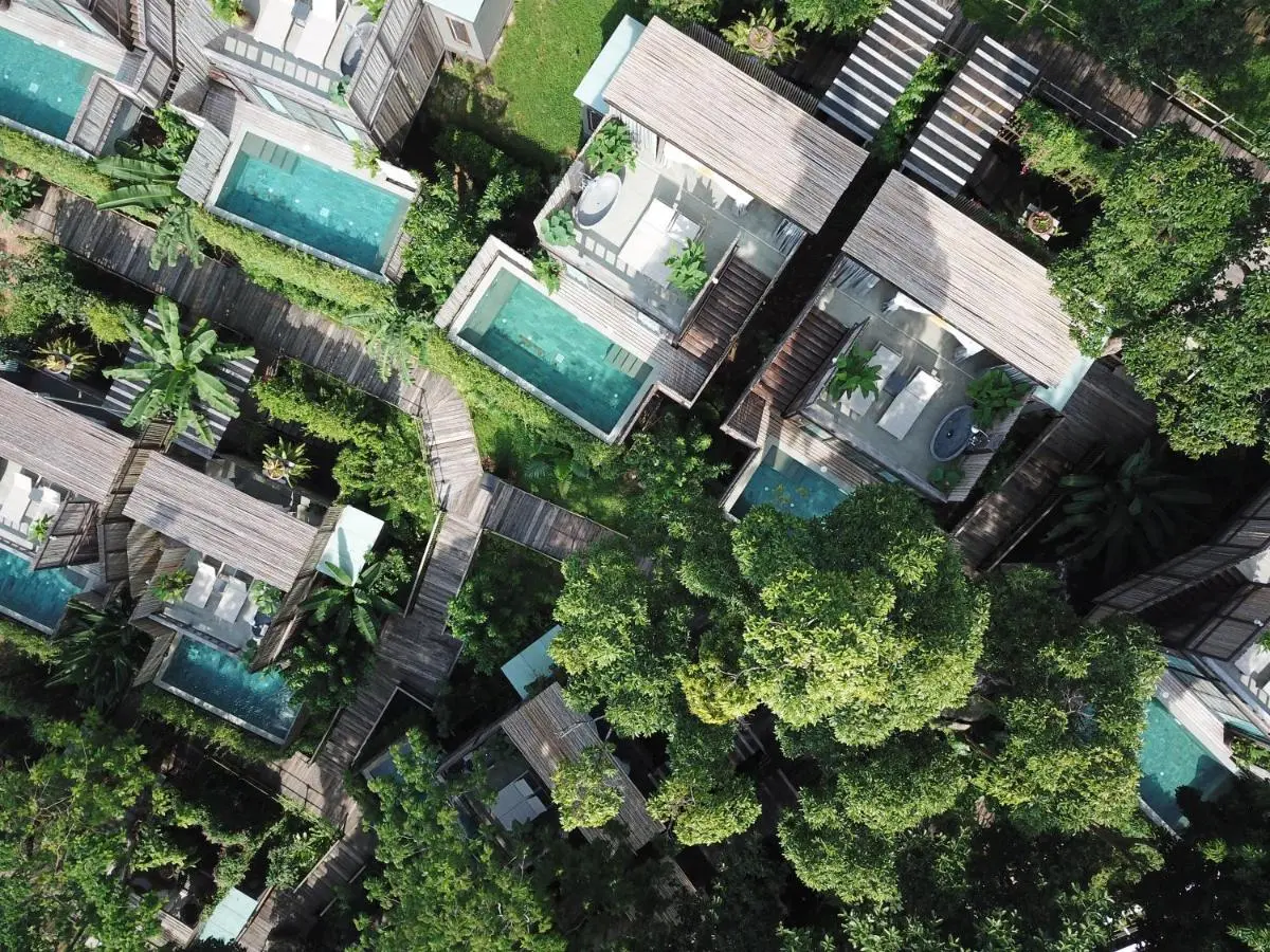 Dinso Resort & Villas Phuket, Vignette Collection by IHG Aerial View of Private Pools and Wooden Decks Surrounded by Tropical Vegetation at Patong Beach Thailand