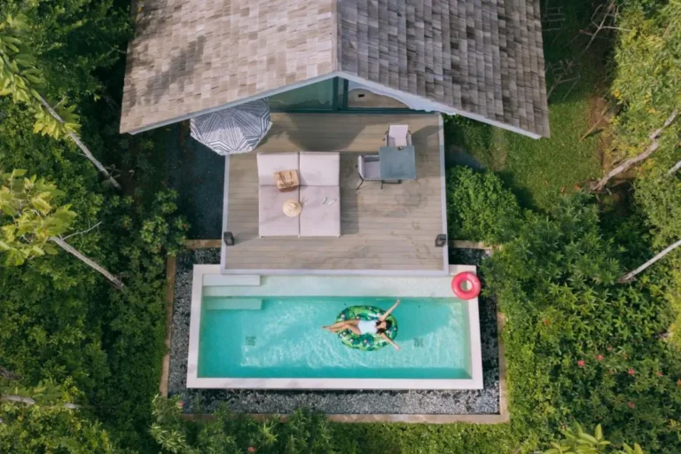 Aerial View of Private Rectangular Pool with Wooden Deck and Lush Greenery in Phuket Town Aerial View of Private Rectangular Pool with Wooden Deck and Lush Greenery in Phuket Town