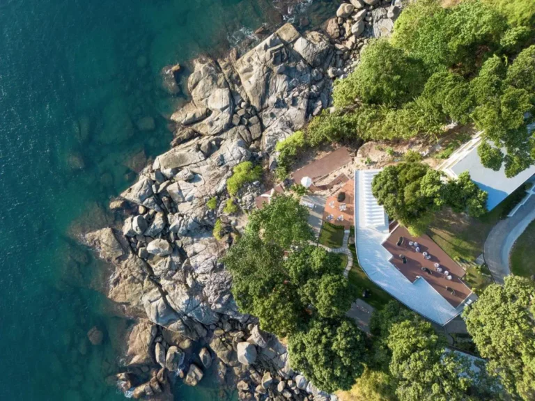 Aerial View of Rocky Shoreline and Modern Outdoor Structures at Karon Beach