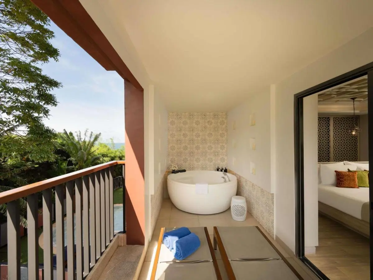 Phuket Province Balcony Soaking Tub and Lounge Chairs Overlooking Greenery and Water at Karon Beach