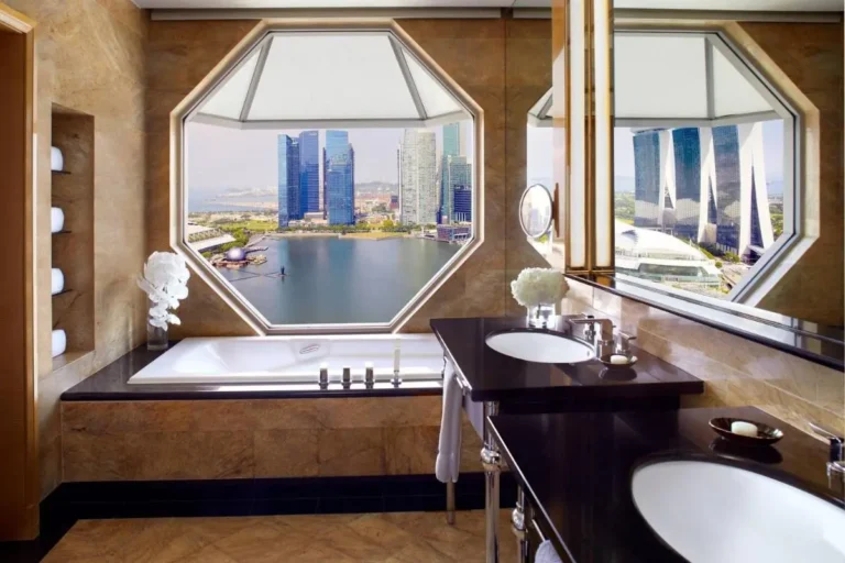 Bathroom with Built-In Bathtub and Double Vanity Overlooking Marina Bay Waterfront