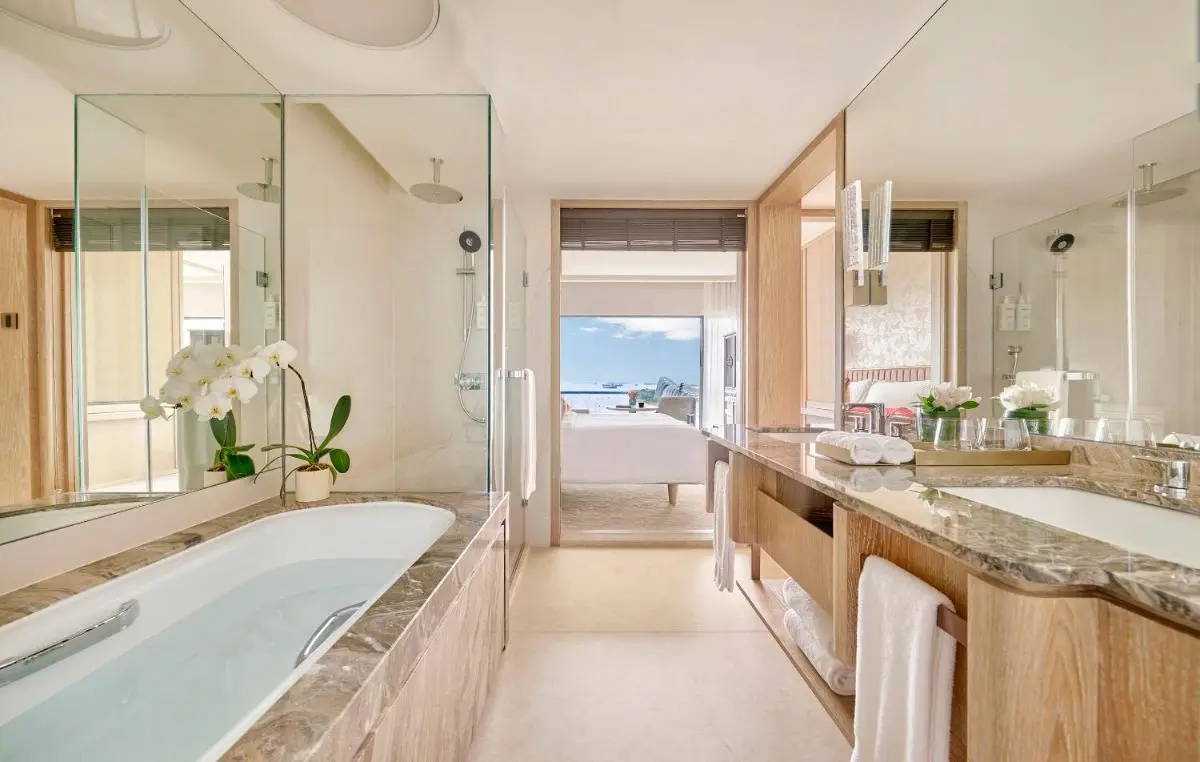 Bathroom with Built-In Bathtub and Shower in Marina Bay Hotel Room