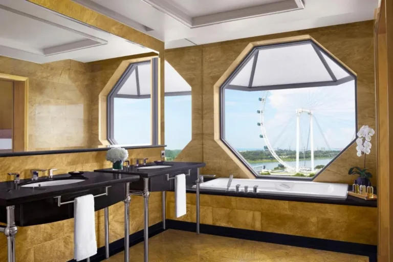 Bathroom with Large Bathtub and Double Sink Vanity Overlooking Marina Bay Waterfront