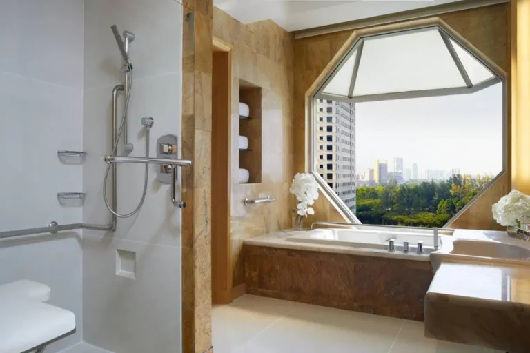 Bathtub and Shower Area with City View in Marina Bay Bathroom
