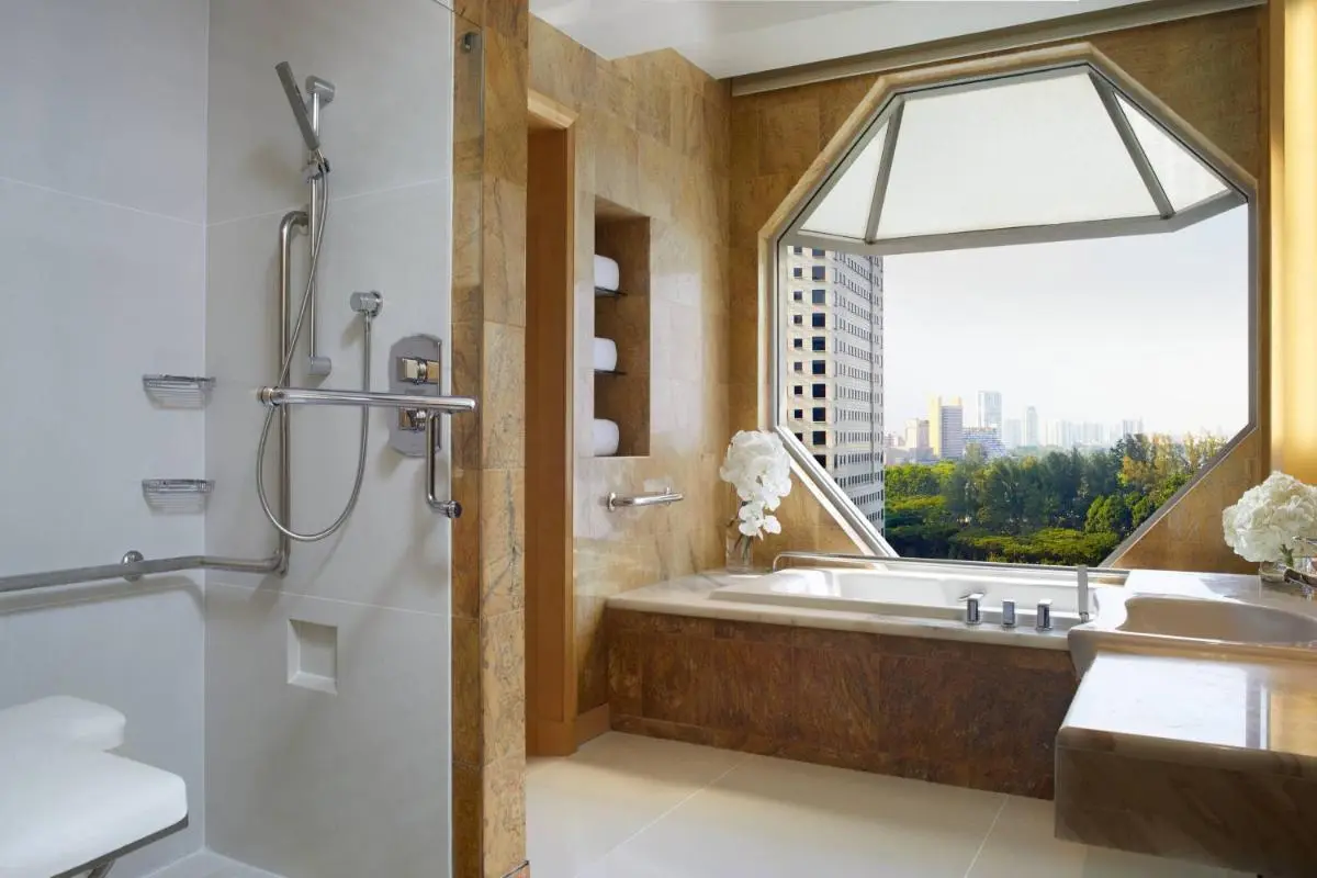 Bathtub and Shower Area with City View in Marina Bay Bathroom