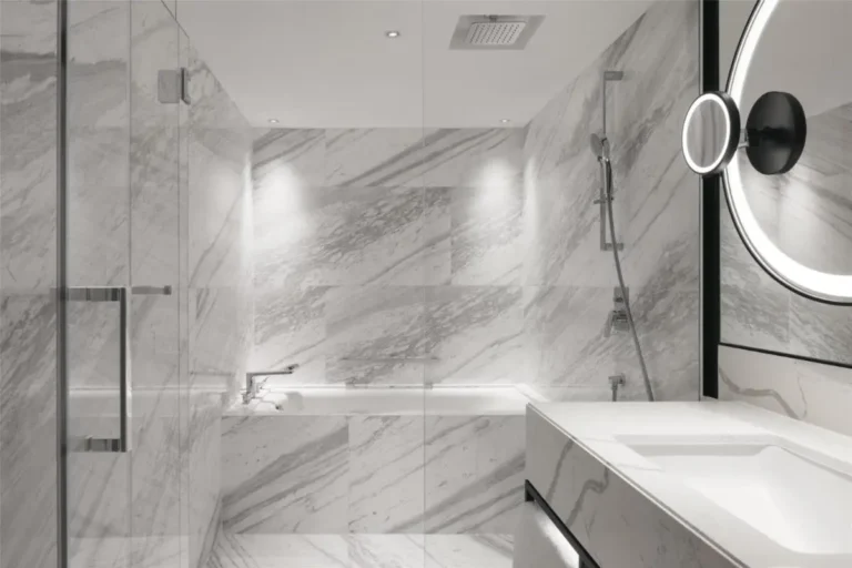 Bathtub and Shower Area with Marble Tiling and Glass Enclosure in Orchard Bathroom