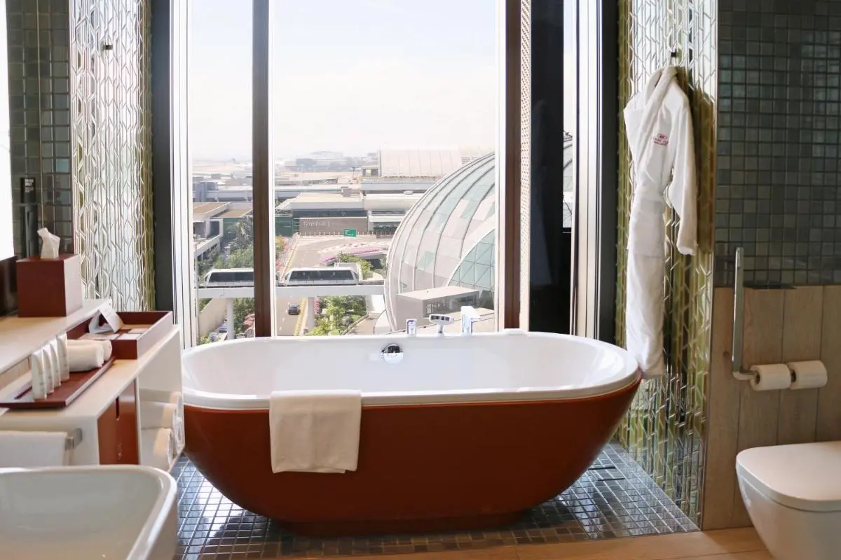 Bathtub with City View and Tiled Bathroom Near Changi Urban Landscape