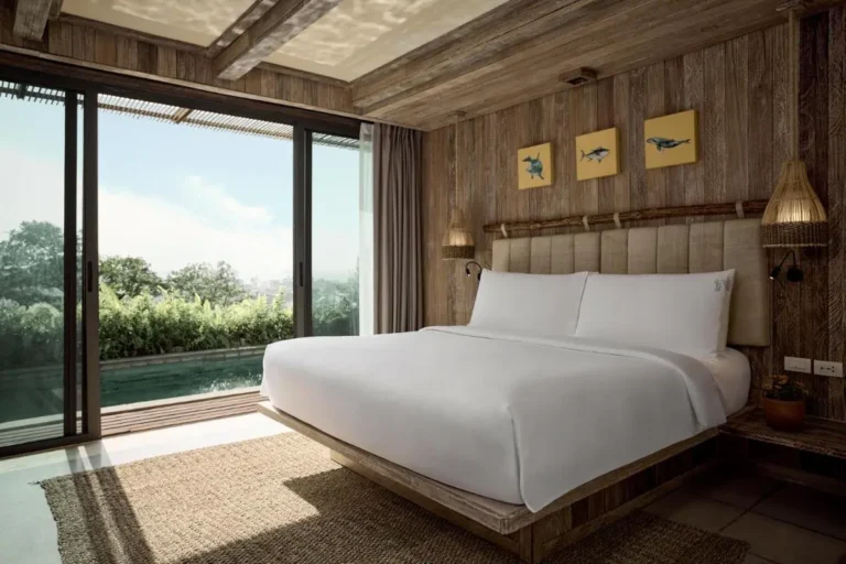Bedroom with Private Pool Access and Natural Wood Interior at Patong Beach