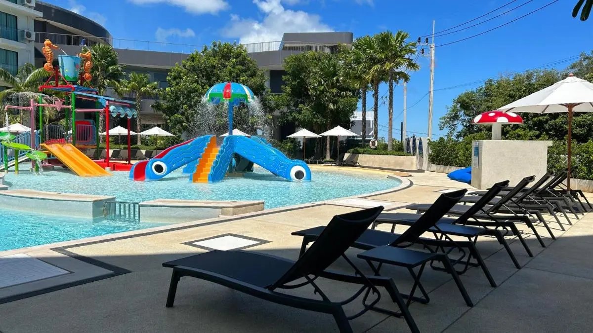 Children’s Outdoor Pool Area with Play Structures and Lounge Seating at Rawai Beach