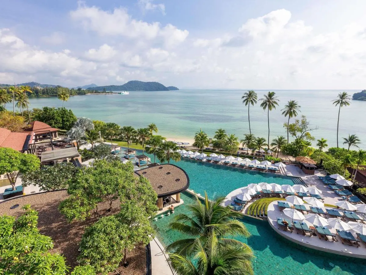 Coastal Resort Pool Area with Swim-Up Bar and Tropical Beach Views at Panwa Beach