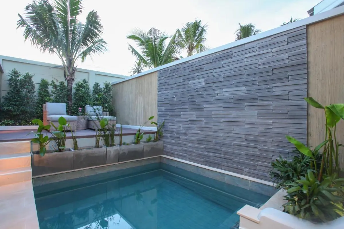 CRAFT Resort & Villas, Phuket Town Compact Outdoor Pool with Wooden Deck and Lounge Seating in Phuket Town