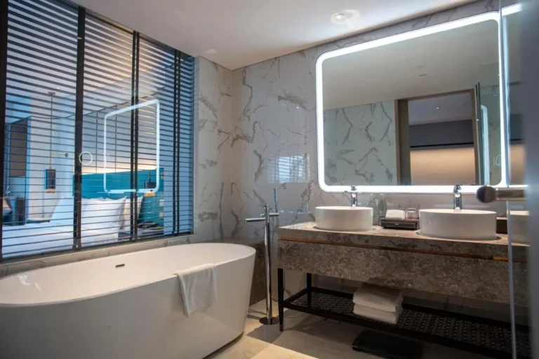 Contemporary Bathroom Design Featuring Freestanding Tub and Dual Vessel Sinks in Ratchathewi