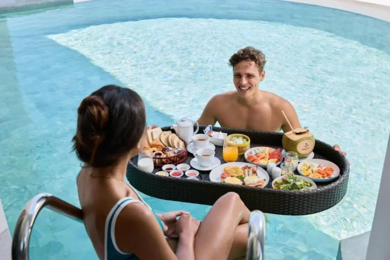 Couple Enjoying Floating Breakfast in Clear Blue Pool at Panwa Beach