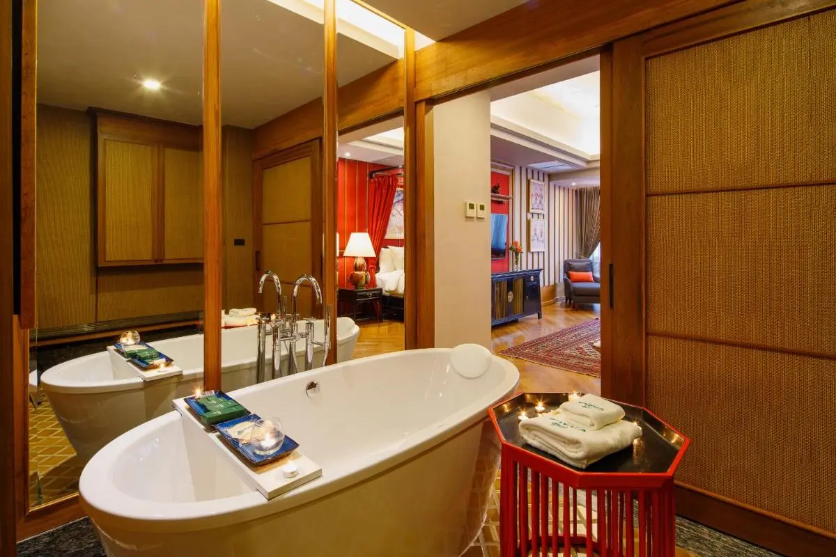 Cozy Indoor Bathroom with Freestanding Bathtub and Warm Decor in Phra Sing Chiang Mai