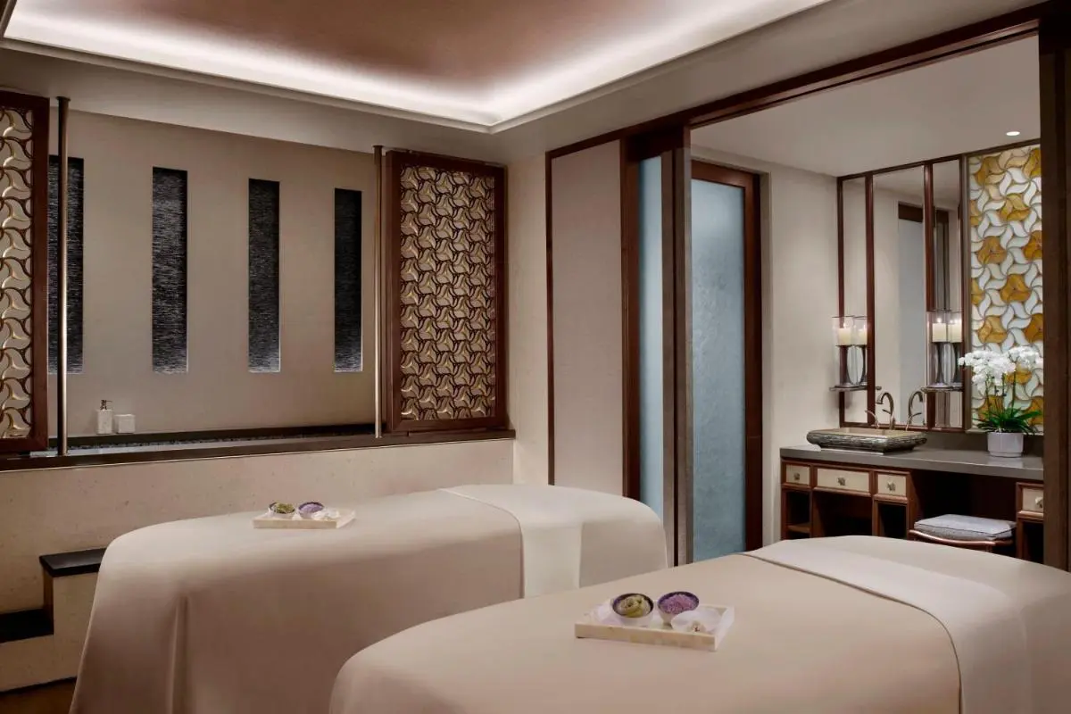 Dual Massage Treatment Room with Natural Materials and Soft Lighting in Marina Bay