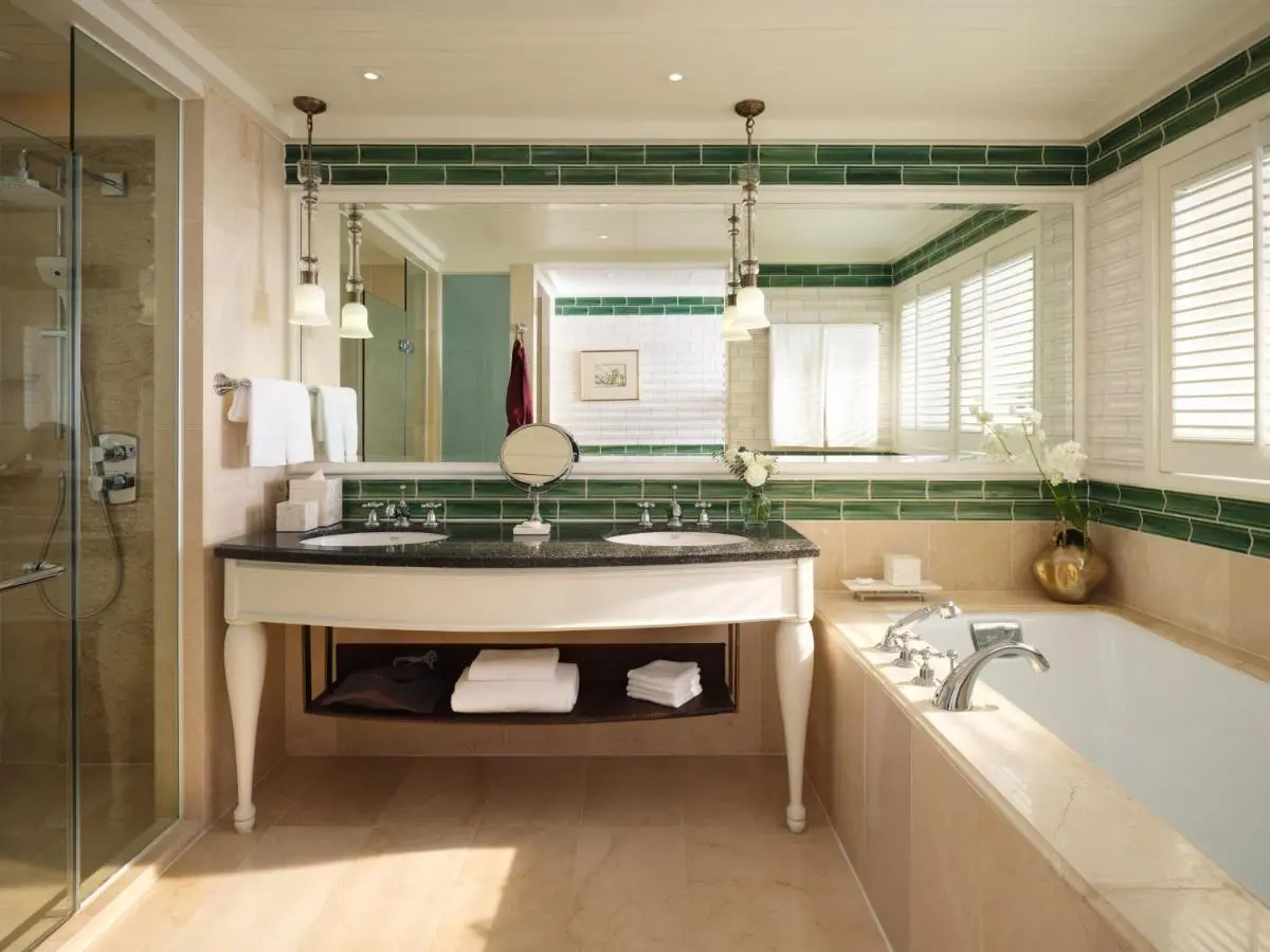 Elegant Bathroom Design Featuring Bathtub, Shower, and Double Vanity in Bang Rak