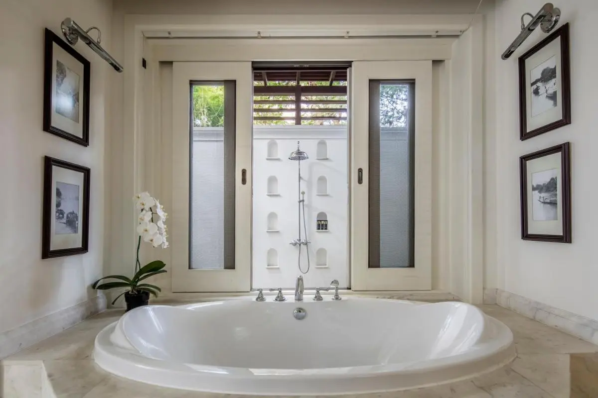 137 Pillars House Elegant Bathroom Design Featuring Oval Bathtub and Outdoor Shower in Wat Ket Chiang Mai