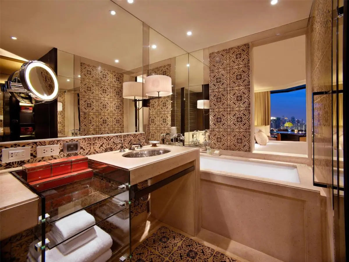 Elegant Bathroom with Built-In Bathtub and City View in Pathumwan Bangkok