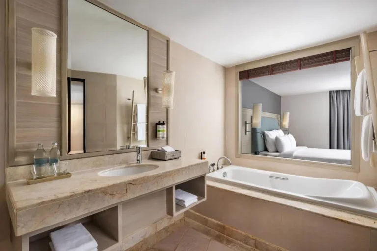 Elegant Beige Bathroom with Built-In Bathtub and Vanity Near Panwa Beach