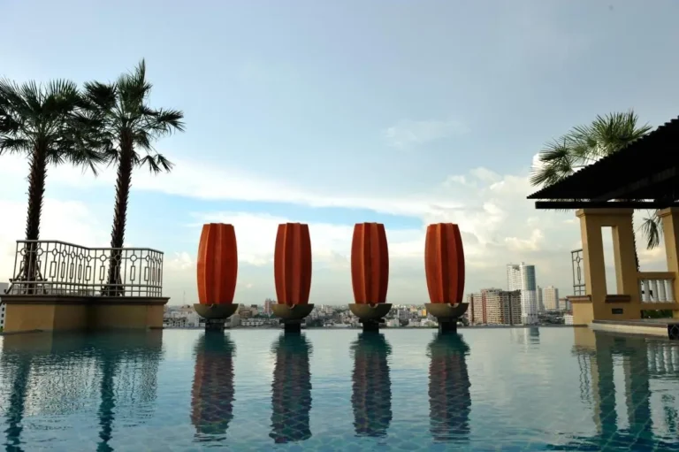 Elevated Infinity Pool with Sculptural Elements and Urban Views in Bangkapi Bangkok