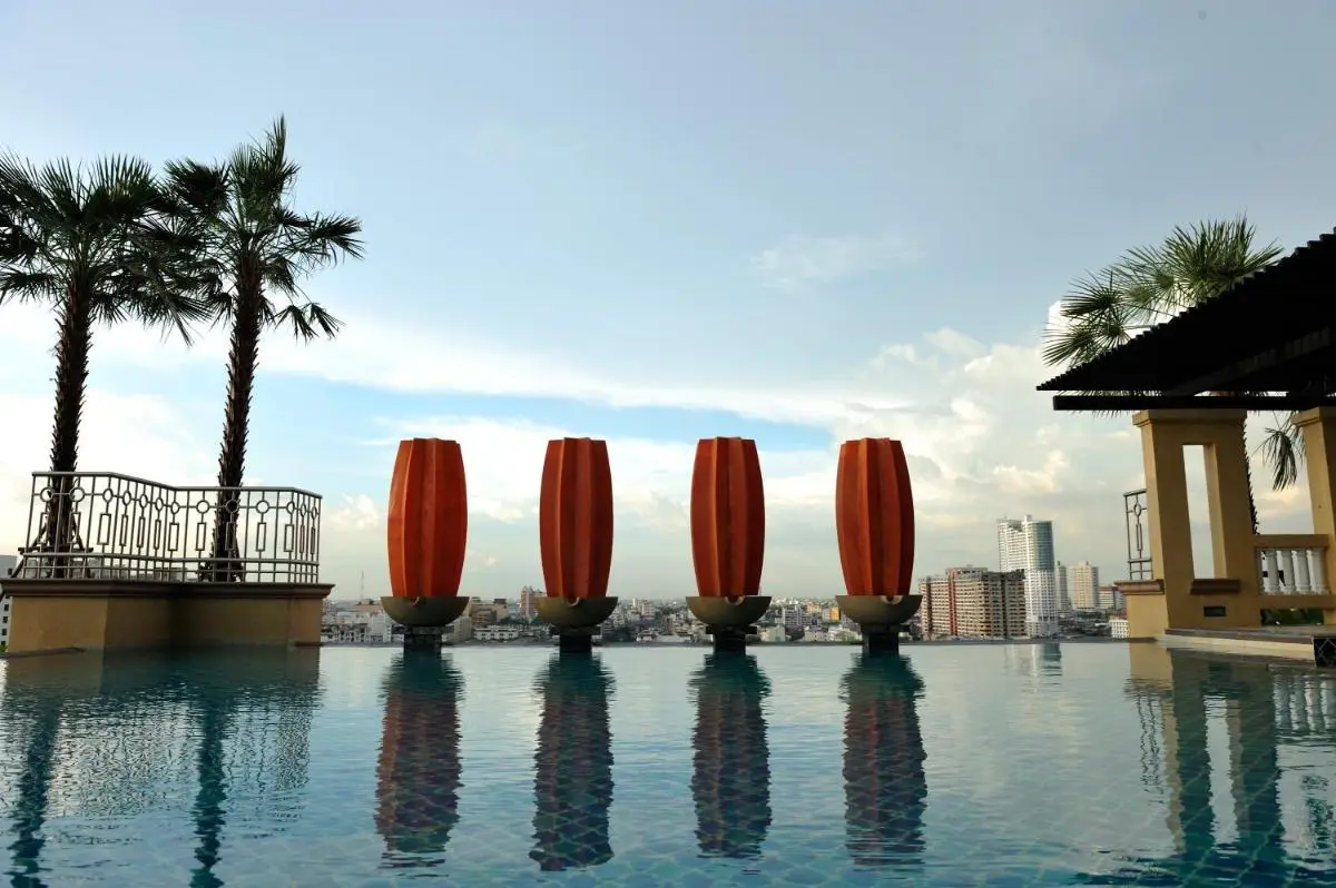 Elevated Infinity Pool with Sculptural Elements and Urban Views in Bangkapi Bangkok
