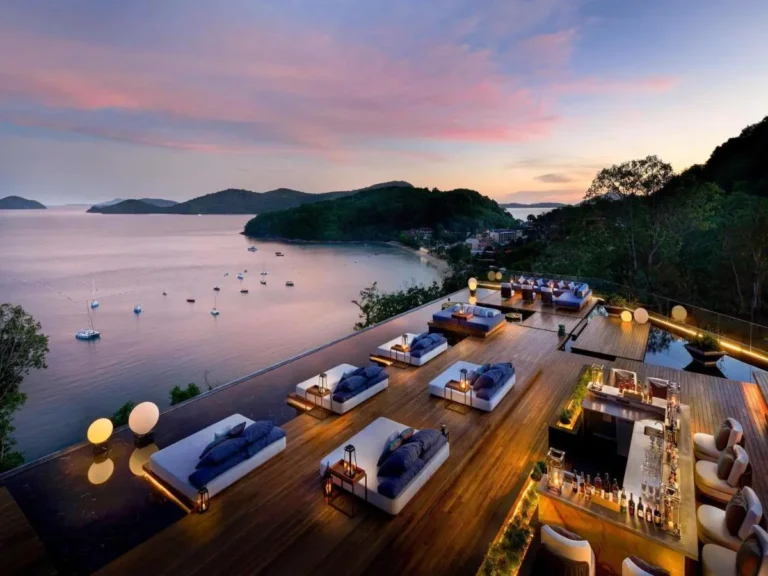 Elevated Outdoor Terrace with Reflecting Pool and Lounge Beds Overlooking Panwa Beach Bay at Sunset
