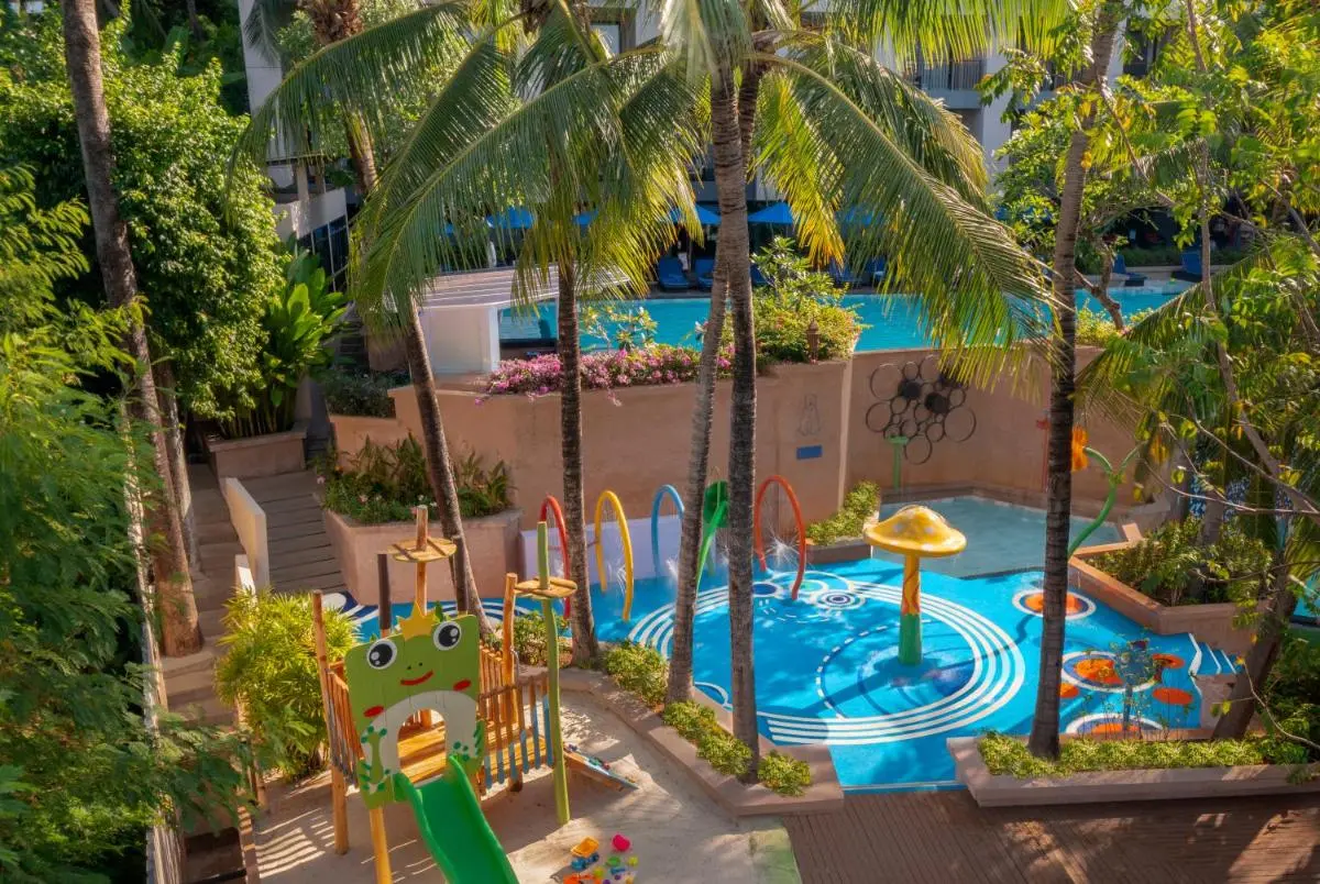 Family-Friendly Outdoor Pool Area with Children’s Splash Zone and Play Structures at Kata Beach