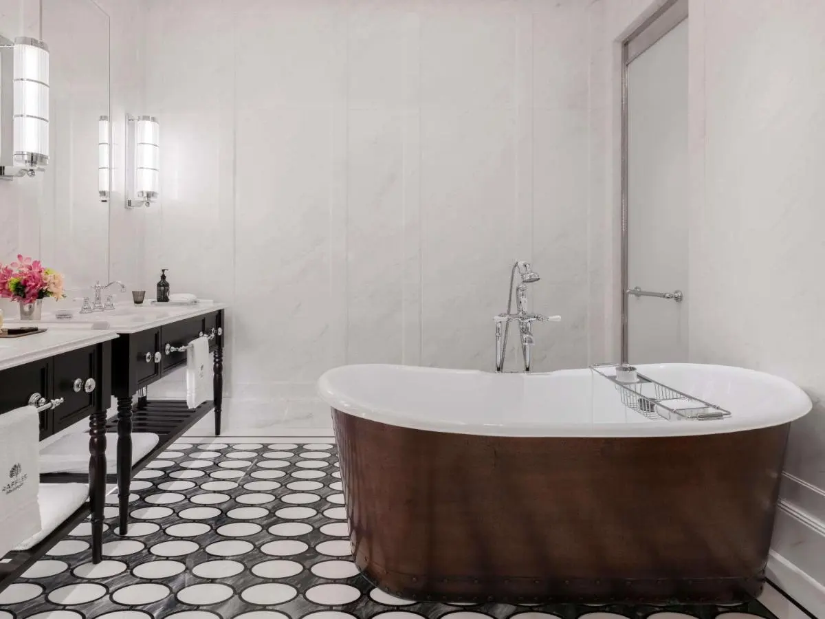 Raffles Singapore Freestanding Bathtub and Double Vanity Bathroom with Patterned Floor in City Hall