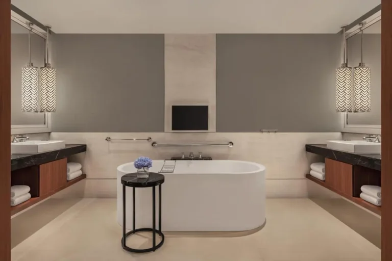 Freestanding Bathtub and Dual Vanity Bathroom Design in City Hall Area