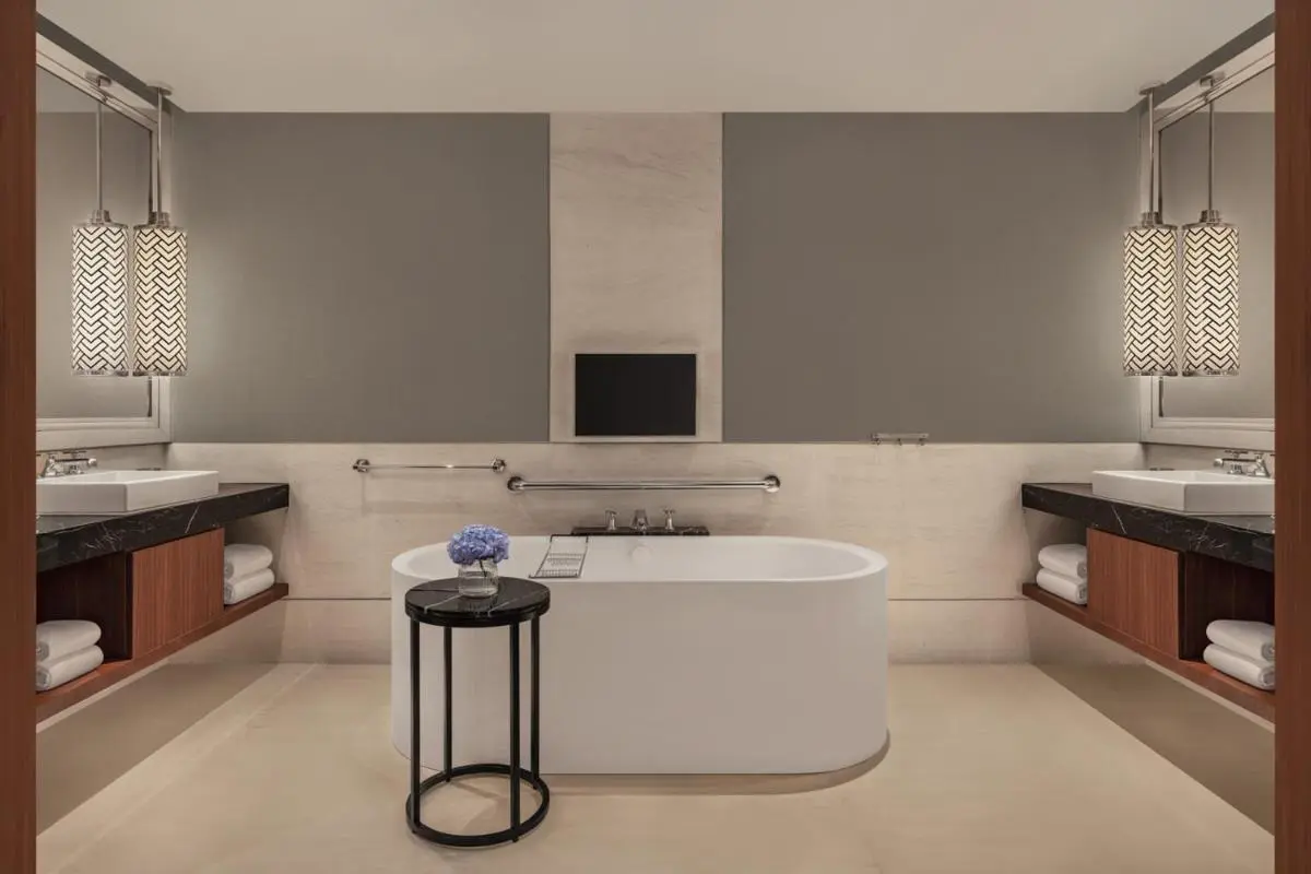 Freestanding Bathtub and Dual Vanity Bathroom Design in City Hall Area