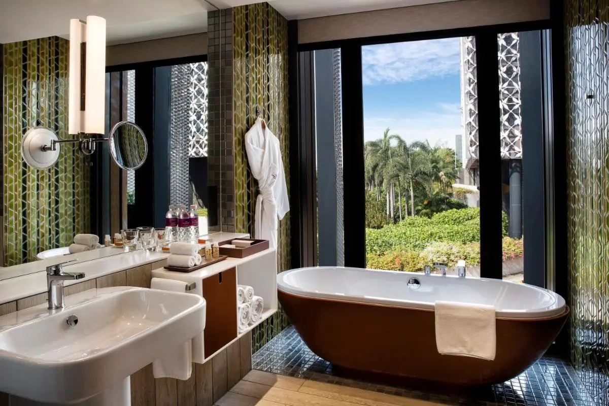 Freestanding Bathtub and Garden View Bathroom Near Changi with Green Mosaic Tiles
