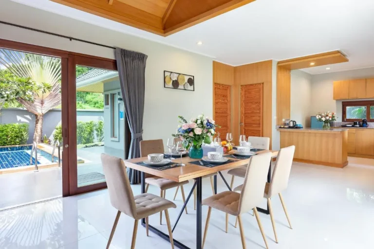 Indoor Dining Area with Outdoor Pool and Kitchen at Rawai Beach Residence Indoor Dining Area with Outdoor Pool and Kitchen at Rawai Beach Residence