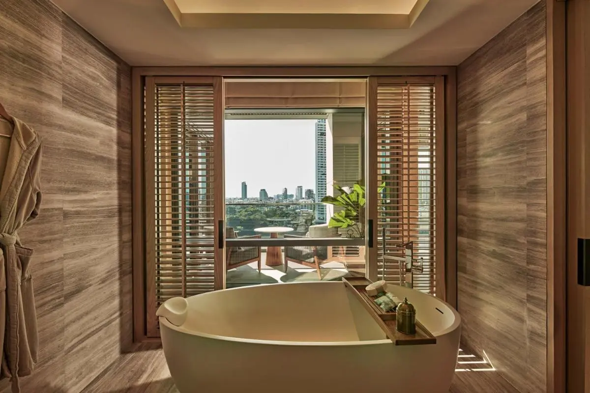 Indoor Freestanding Bathtub with Balcony City Views in Sathorn Urban Setting