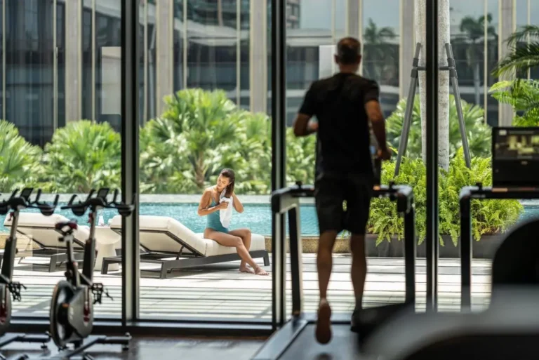Indoor Gym and Outdoor Pool Area with Jacuzzi and Greenery in Sathorn Bangkok