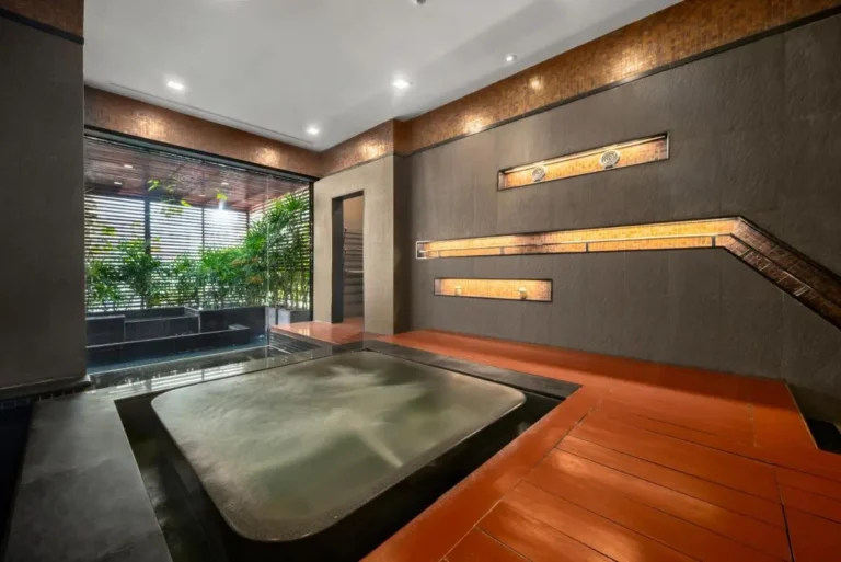 Indoor Hot Tub and Pool Area with Natural Light and Plant Features in Pathumwan Bangkok