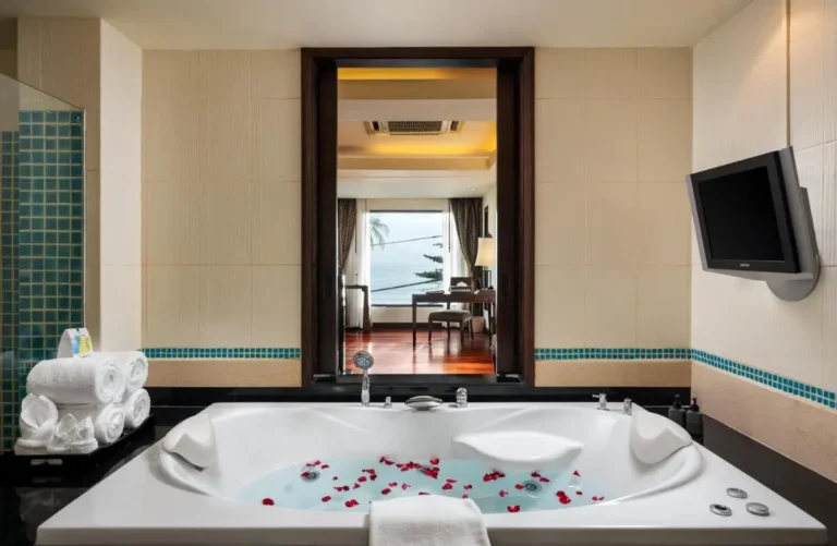 Indoor Jacuzzi Bathroom with Ocean View and Relaxation Amenities at Patong Beach