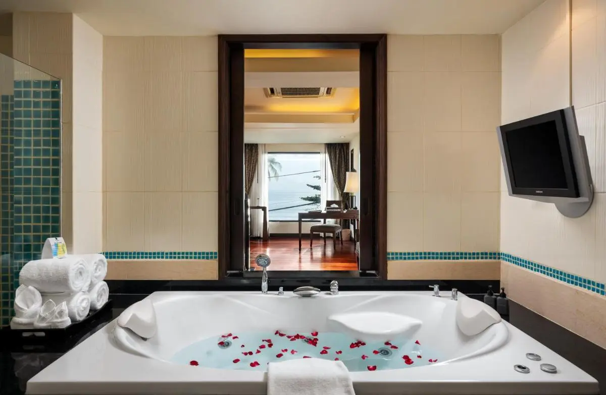 Indoor Jacuzzi Bathroom with Ocean View and Relaxation Amenities at Patong Beach