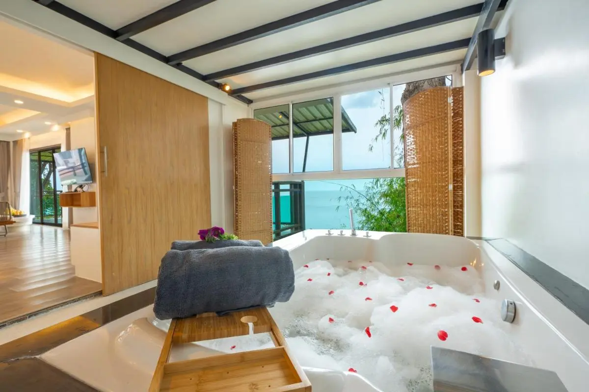 Indoor Jacuzzi with Scenic Ocean View and Relaxing Spa Features at Karon Beach