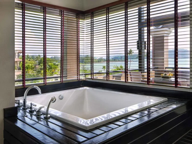 Indoor Jacuzzi with Scenic Water and Mountain Views at Panwa Beach Retreat
