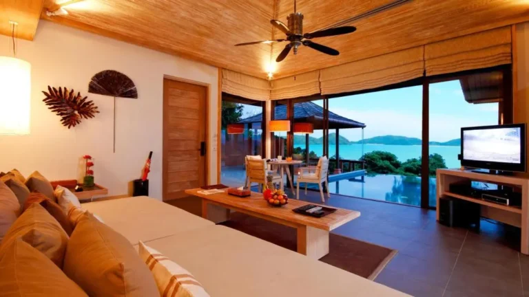 Indoor Living Space with Infinity Pool and Scenic Panwa Beach Views
