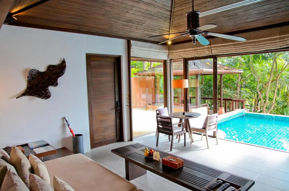 Indoor-Outdoor Living Space Featuring Blue Tiled Pool and Wooden Ceiling Fan at Panwa Beach