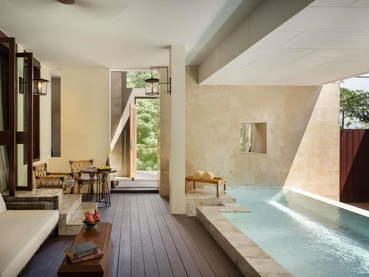Indoor-Outdoor Relaxation Space with Rectangular Pool and Natural Stone Elements at Patong Beach